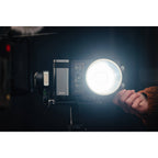 Zhiyun Molus X100 Pro bi-color LED light with adjustable brightness and color temperature, shown with mounted controls and stand.