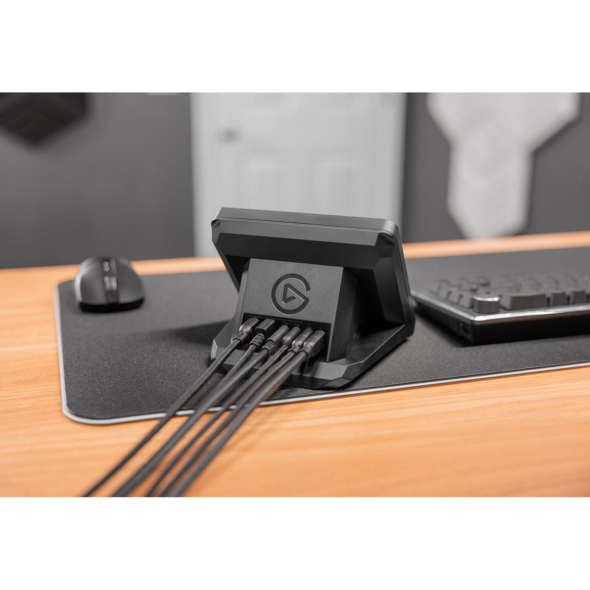 Elgato USB hub for Stream Deck+ with multiple ports, compact design, and sleek black finish for connecting video and streaming devices.