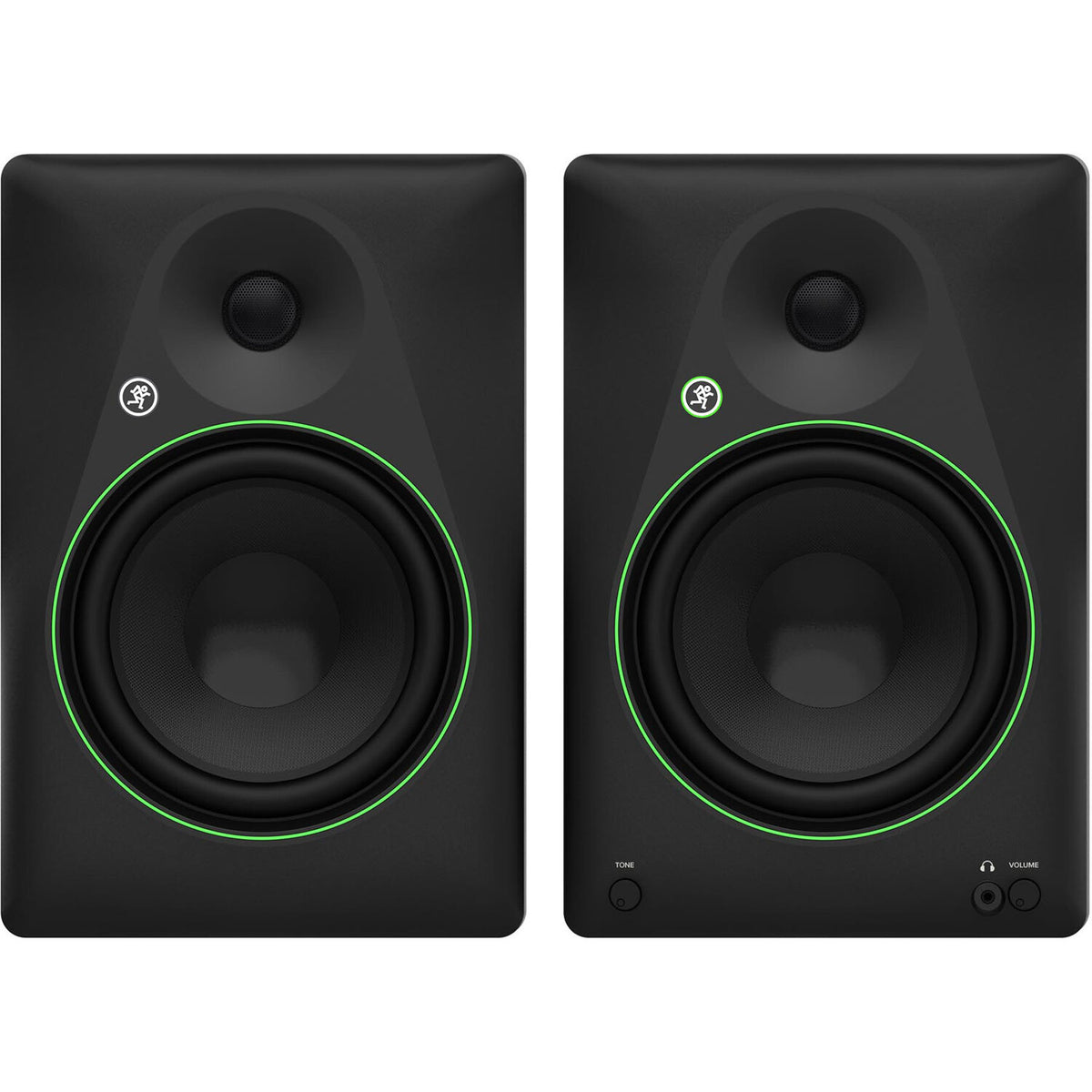 Mackie CR8BT desktop speakers with black finish, featuring control knobs and Bluetooth connectivity, on a wooden desk setup.