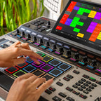 Akai Professional MPC XL drum machine and sampler with large touch screen, numerous pads, and control knobs for music production.