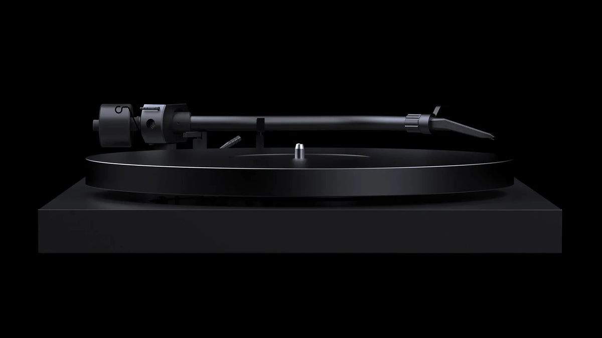 Pro-Ject Debut Pro S turntable in satin black with a sleek design, featuring a tonearm and platter for high-quality vinyl listening.