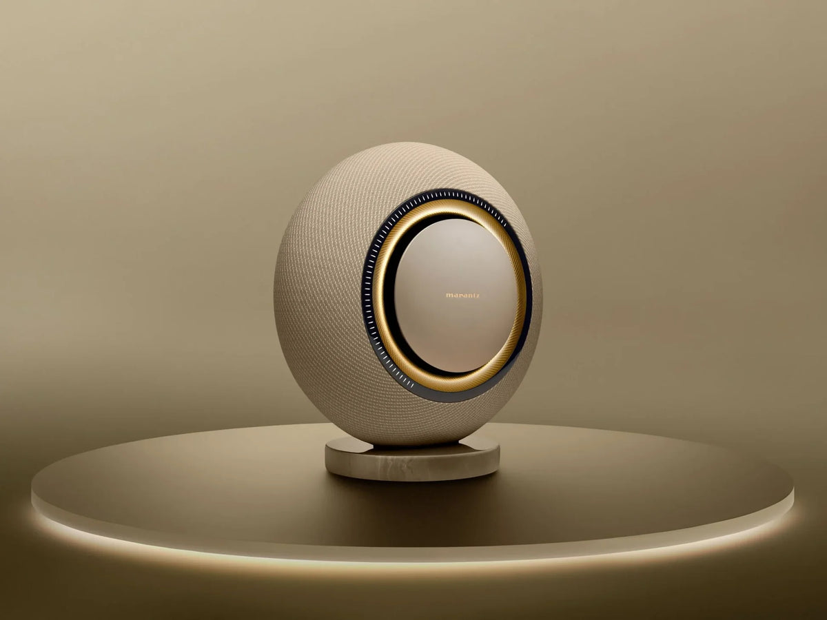 Marantz Horizon wireless speakers in champagne finish, sleek modern design with fabric grille and compact form for premium audio.