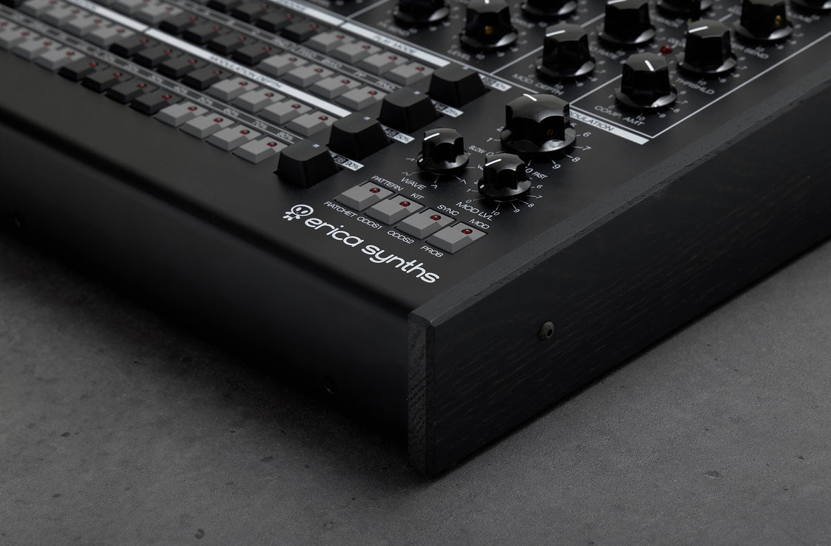Black Erica Synths Perkons HD-01 drum machine and sampler with knobs, pads, and display, designed for electronic music production.