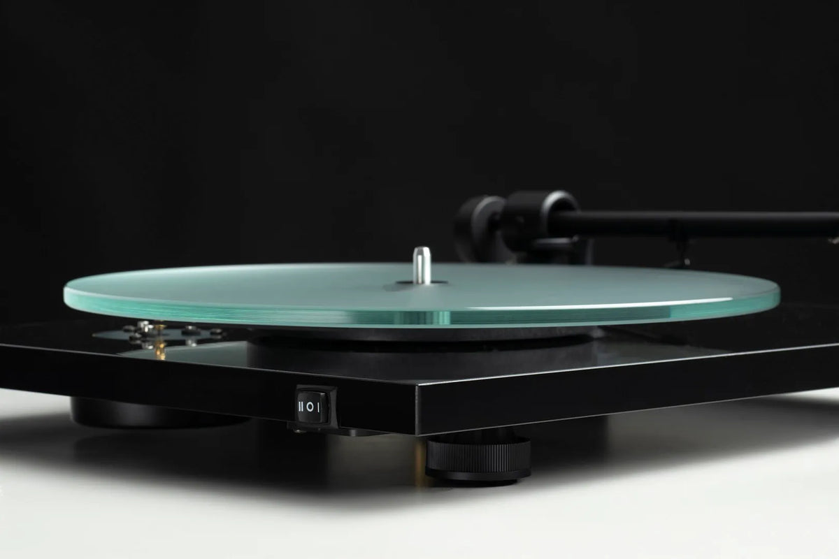 Pro-Ject T1 EVO turntable showing the speed switch for selecting 33 or 45 RPM playback.